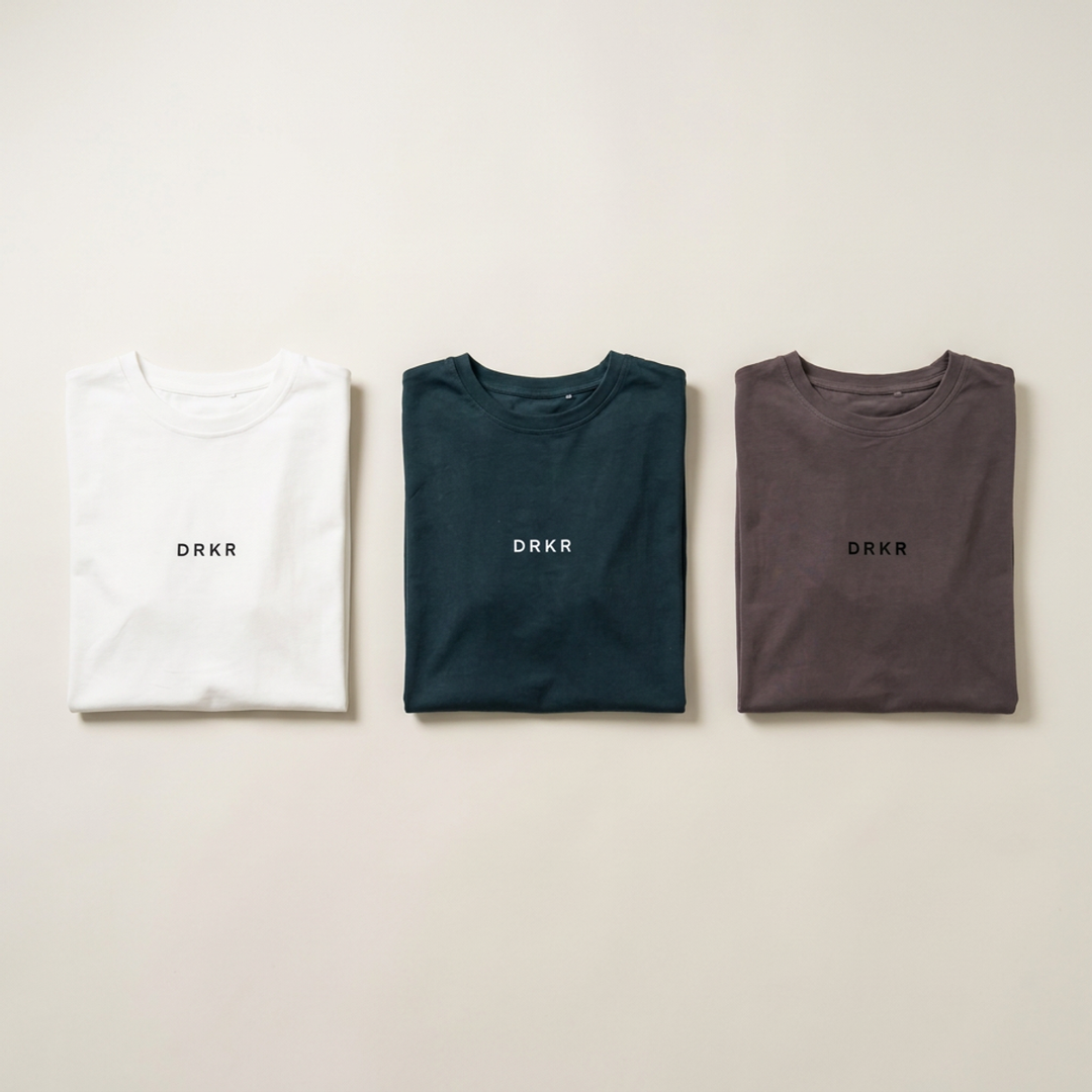 Endure 3 Tee Bundle flat lay: Endure Oversized Tees in white, forest green and storm grey