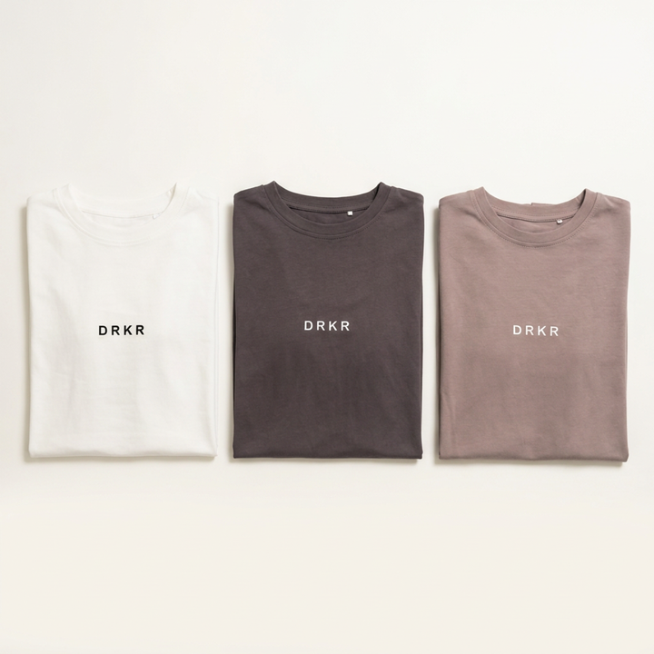 Endure 3 Tee Bundle flat lay: Endure Oversized Tees in white, storm grey and dusty pink
