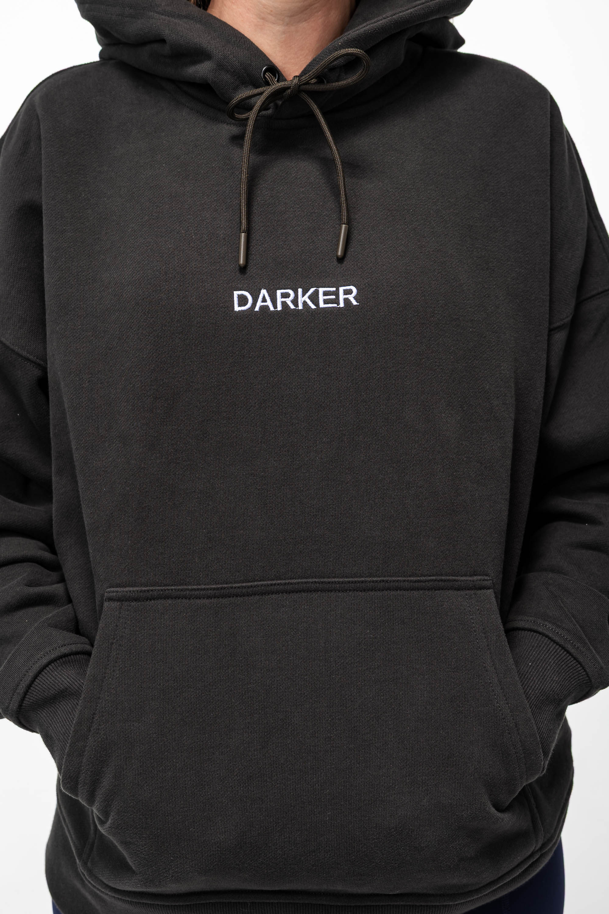 Black hoodie with 'DARKER' text on a white background