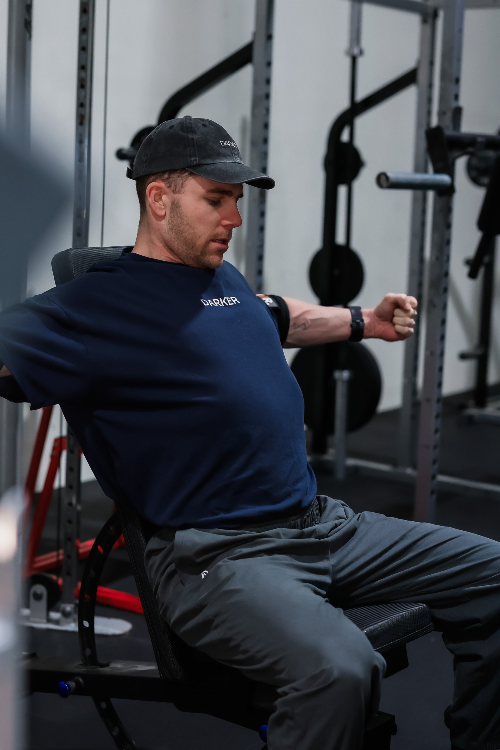 Man exercising on a bench press in a gym setting