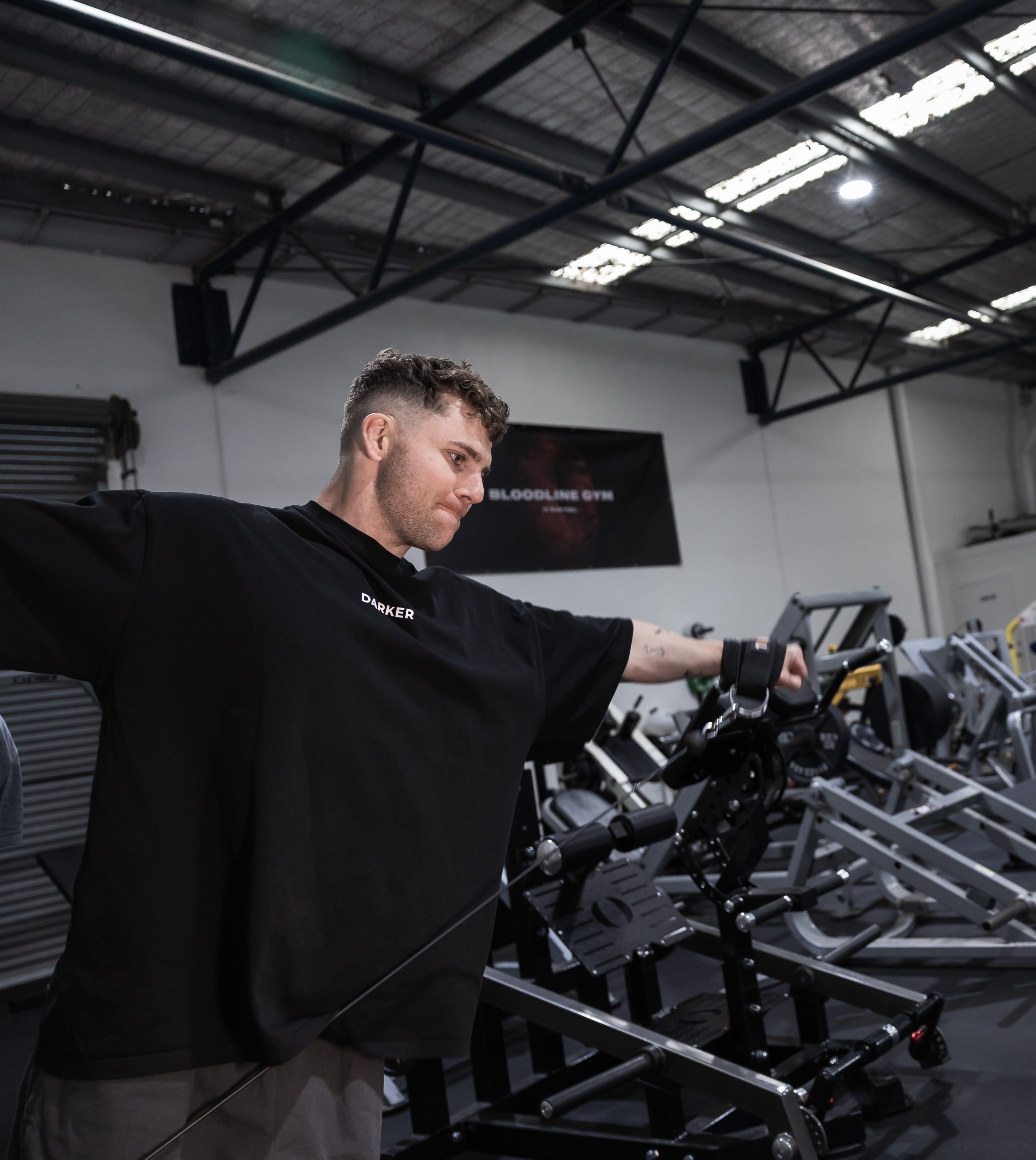 Man in a gym setting using exercise equipment