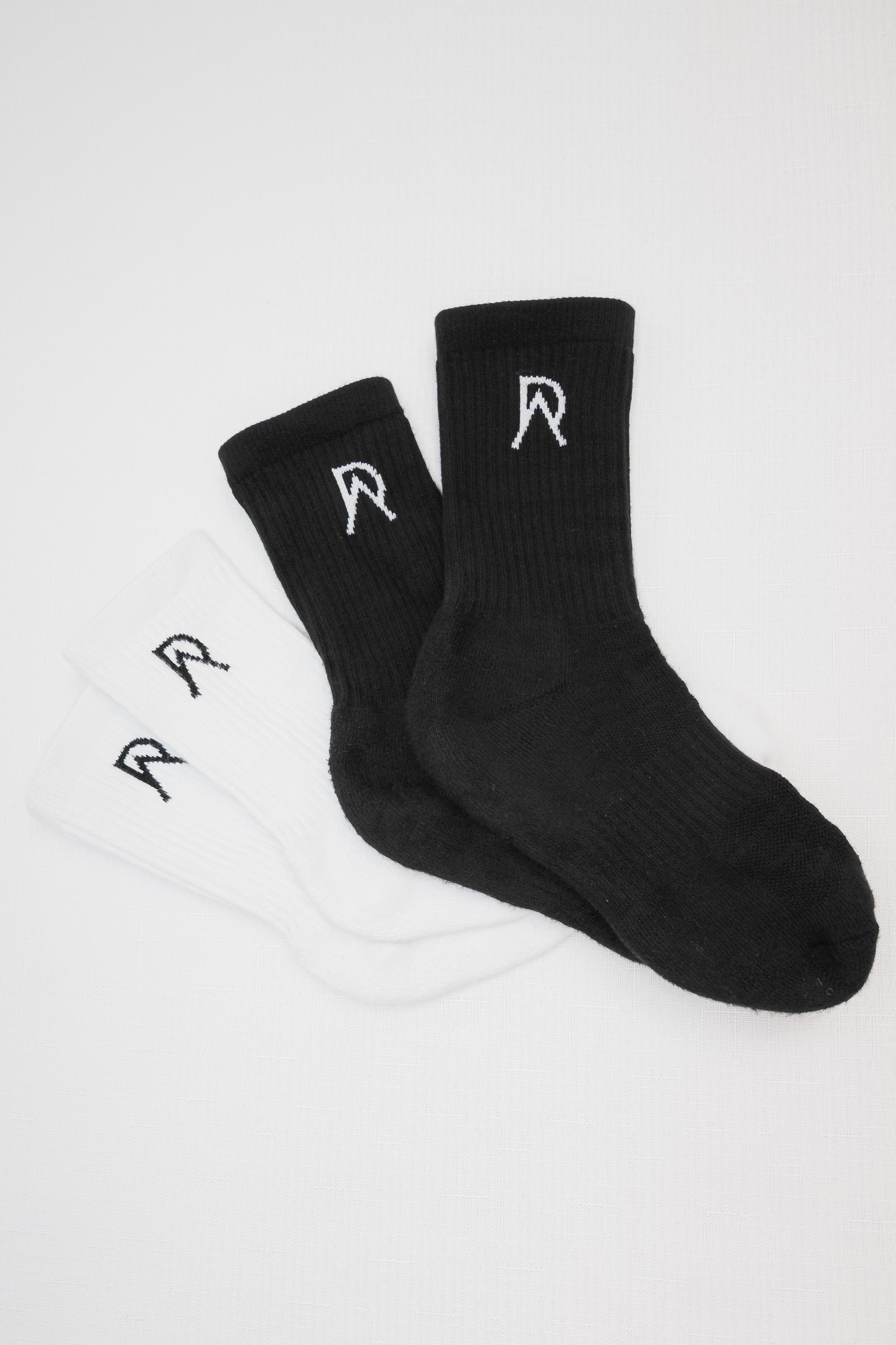 Black and white socks with a logo on a white background