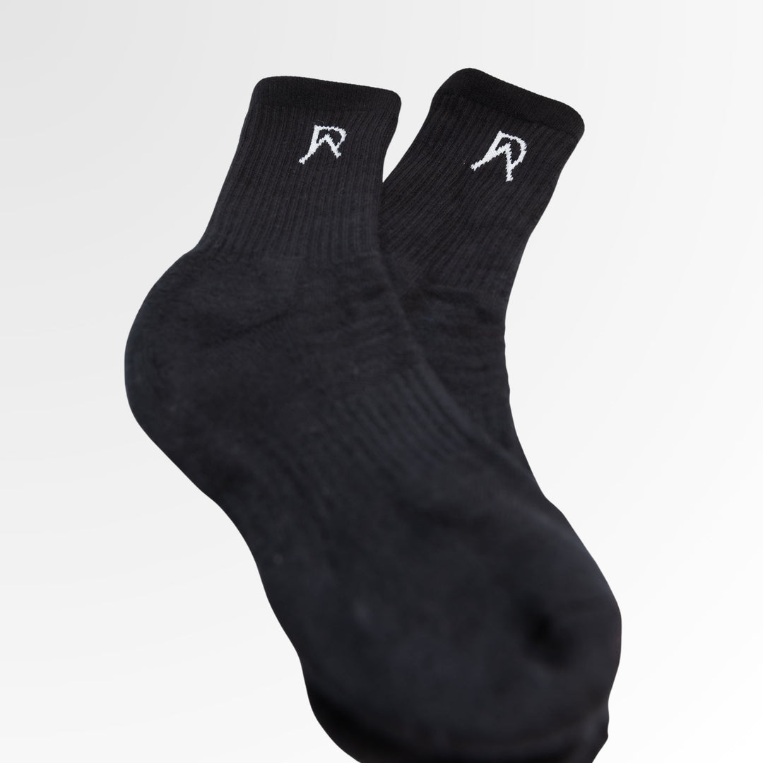 Pair of black Agile Crew Socks from the Workout Sock Bundle showing the ankle logos