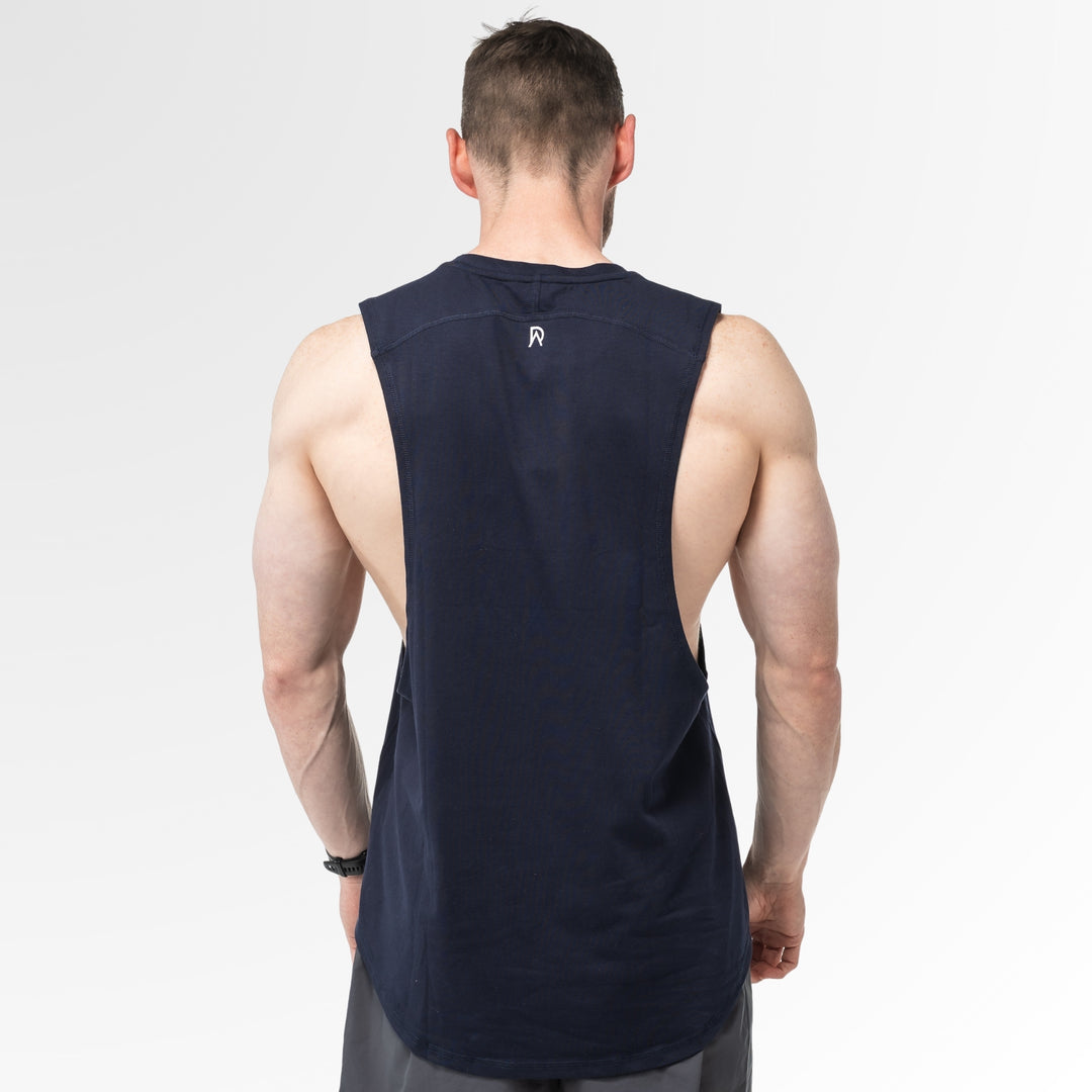 Man wearing a navy Agile Tanks on a white background