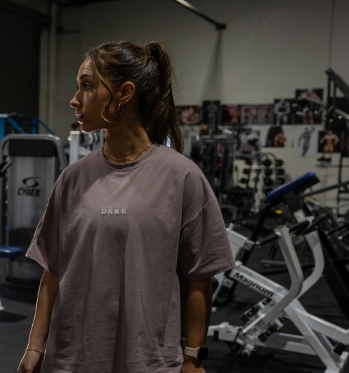 Woman training in a Darker Apparel oversized tee