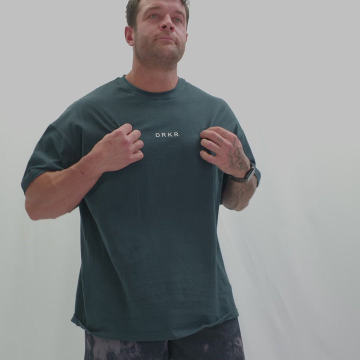 Video of a man in the Endure Oversized Tee showing the relaxed oversized fit